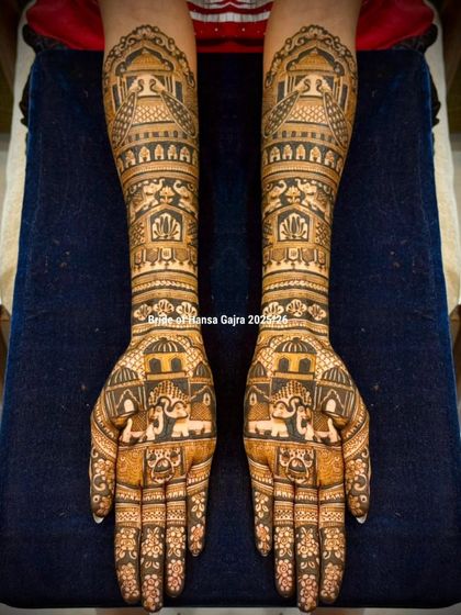 An architecture-inspired bridal design. The arms are adorned with patterns resembling royal domes and arches, creating a unique and majestic look that stands out.