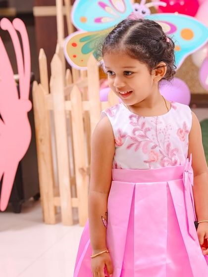 A thrilling 'Hot Wheels' themed birthday party, with checkered flags, car cutouts, and a custom racetrack backdrop, perfect for little speed enthusiasts.