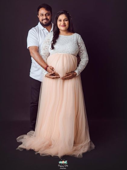 A classic hands-on-belly pose that never fails to show the love. The combination of the lace and tulle gown adds a soft, romantic touch.