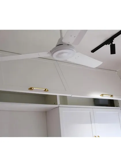 These white PU finish upper cabinets feature a classic shaker design and elegant gold handles. The bi-fold lift-up mechanism provides easy access to the entire cabinet interior.