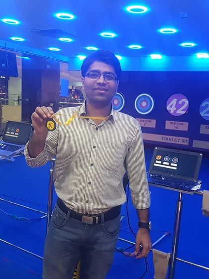 Another satisfied archer showing off his medal. Our facility is equipped with everything you need to practice and succeed.