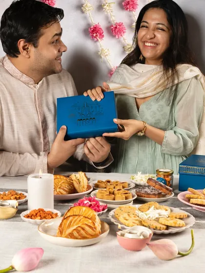 Gifting is a language of love, and our Meetha Maska Diwali collection is designed to speak from the heart. Here, a beautifully packaged gift box is shared between siblings, capturing the joy of giving and sharing during the festive season.