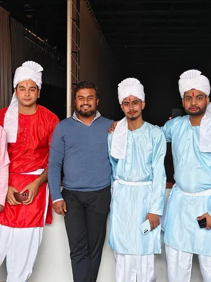 Posing with the performers backstage. A key part of my job is ensuring the artists are prepared and motivated to give their best performance.