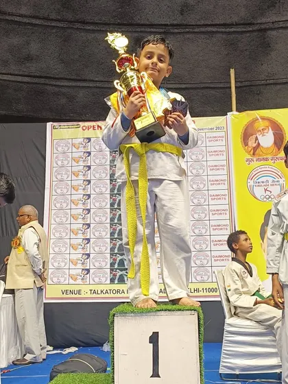 This young champion is on top of the podium after winning his category at the national championship.