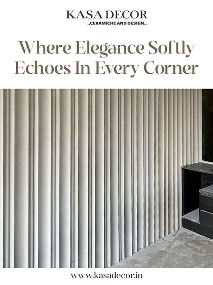 Our 'Drape' concrete panels used to create an elegant, rhythmic wall. The vertical lines add a sense of sophistication and order, echoing the clean aesthetic of the surrounding decor.