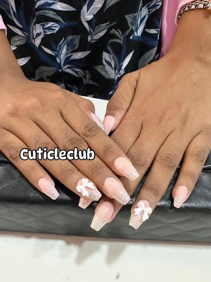 Another take on the shimmery coffin nail set, showing how the 3D bows add texture and a focal point to the design.