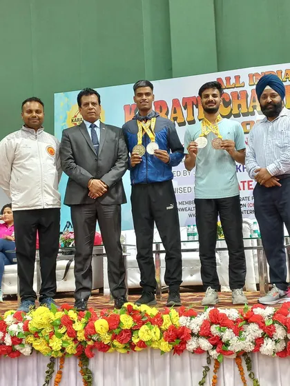 Harshit and Tushar on the podium with Hanshi Bharat Sharma ji after their successful run at the National Karate Championship in Dehradun.