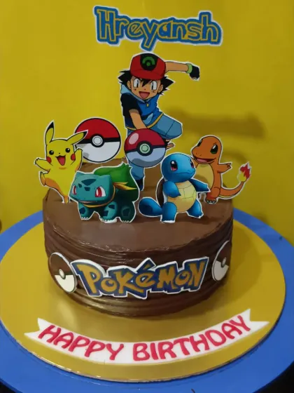 "Gotta catch 'em all!" This Pokémon-themed cake features Ash, Pikachu, and the starter Pokémon, perfect for any young Pokémon trainer's birthday.
