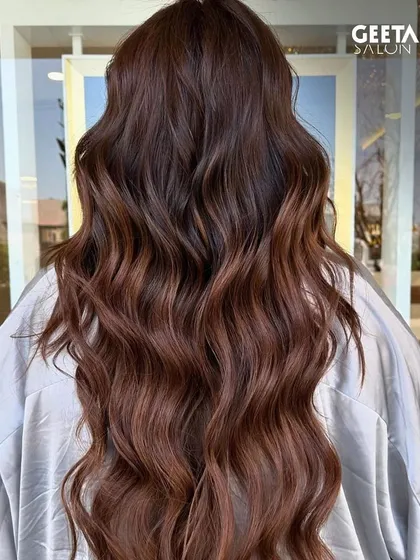 A rich, warm brown that looks incredibly shiny and healthy, with perfectly sculpted waves.