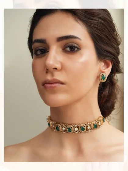 A simple yet stunning emerald choker, perfect for adding a pop of color to any outfit.