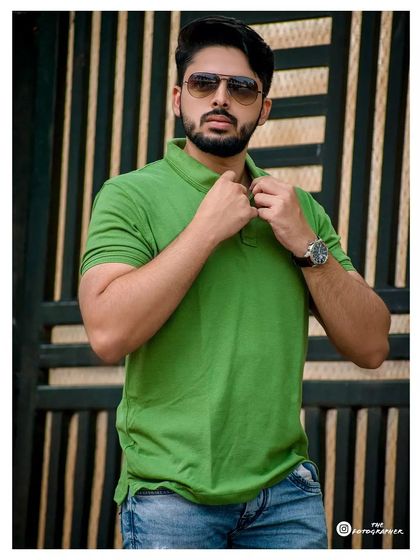 A clean, casual men's fashion shot against a modern background. Perfect for a social media profile or a relaxed portfolio.