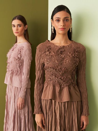 This collection of pleated co-ord sets by Aruni redefines power dressing with sculptural forms and a hint of drama. Available in earthy tones, they are perfect for gallery nights, power meetings, or even a destination wedding with an edge.
