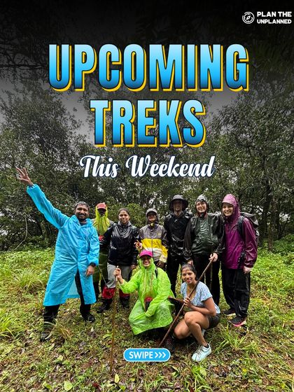 A group of trekkers in raincoats, all smiles in the middle of a lush forest. Our weekend treks run rain or shine, offering a true monsoon adventure.