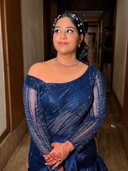 This client was ready for a cocktail party in a stunning navy blue gown. I created a matching blue smokey eye and kept the rest of the makeup fresh and dewy to let the eyes be the focus.