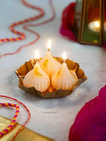 Here are my modak candles, all lit up and glowing. They look so beautiful in a traditional brass plate and are perfect for your Ganesh Chaturthi or Diwali pooja.