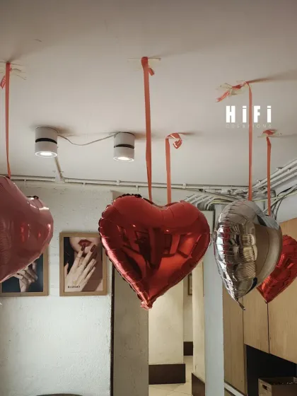 This simple arrangement of four hanging heart balloons shows that you don't need a massive installation to create a festive mood. This is a great example of a subtle yet effective decoration for a smaller space.