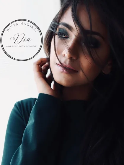 A moody and beautiful shot of a smoky eye. The way her hair falls across her face adds to the mystery and allure of the dramatic eye makeup.