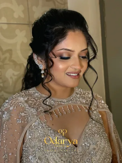 For her Sangeet, we went for this glamorous yet subtle look. I created a soft smokey eye with a neutral lip to complement her stunning embellished gown, and a romantic wavy hairstyle to complete the look.