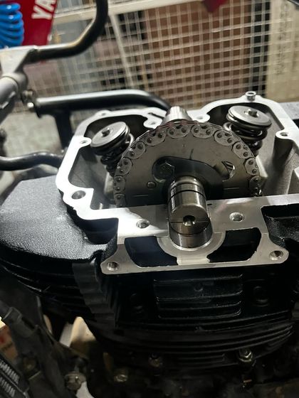 A close-up of the Himalayan's new engine head, showing the camshaft and timing chain assembly.