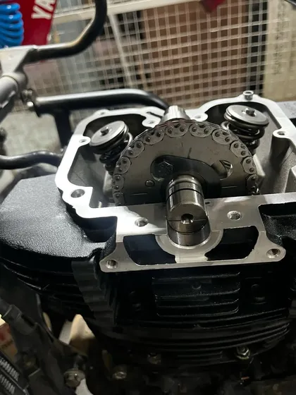 A close-up of the Himalayan's new engine head, showing the camshaft and timing chain assembly.