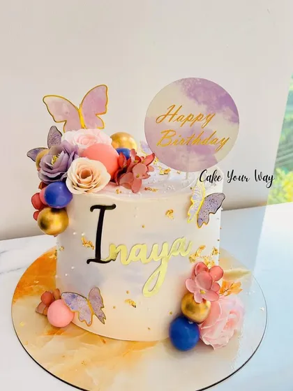 Butterflies, blooms, and golden dreams. A beautiful cake with a marble effect base.