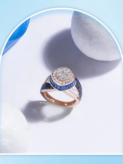 Where natural diamonds find a blue-hued soul. This ring, with its cluster of diamonds and halo of blue sapphires, is crafted for those who see jewellery as art in its purest form.