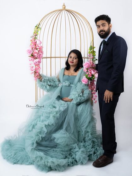 A formal and elegant portrait of the couple with our golden birdcage prop. This setup is perfect for a grand and timeless look.
