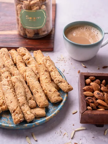 Chai time just got better with my crunchy Almond Fingers. They are the perfect nutty and crisp pairing to enjoy with your precious tea moments.