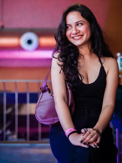 A candid moment of a guest enjoying the party atmosphere.