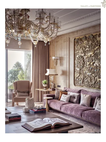 A detail from a living room, showcasing a classic wingback chair and a stunning, hand-carved wall panel depicting a traditional scene. This is a testament to our dedication to craftsmanship and the integration of art into our spaces.