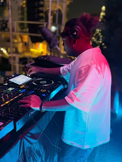 Locked in at an outdoor event. Whether it's under club lights or the night sky, my focus is always on the music and the crowd. The setup is clean, and the beats are heavy.