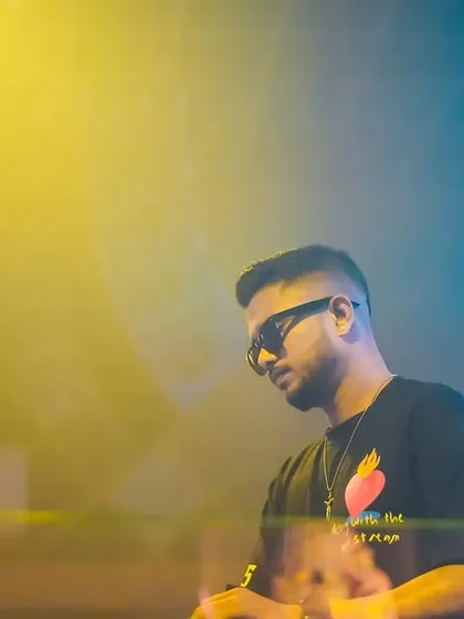 A close-up shot of me at Club EDL, with the yellow and blue lighting creating a vibrant, colorful mood.