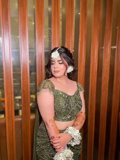 Green and gorgeous! My beautiful bride Simi chose a dreamy Mehendi look with an olive green lehenga and floral jewelry. The makeup was kept soft and glowing to complete the magical vibe.