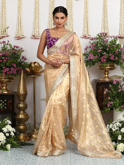The full, standing view of the ivory and purple saree, a picture of ethereal beauty.