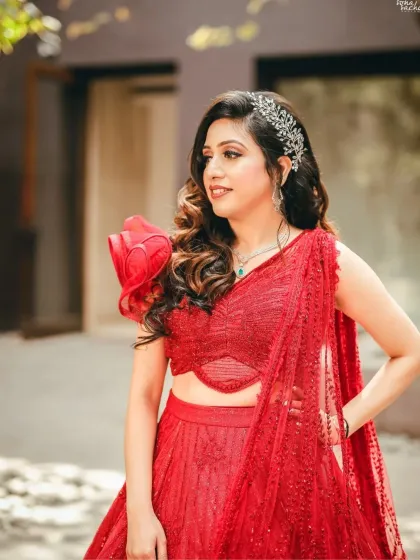 A close-up of the bride's hair and makeup. The soft waves and glamorous makeup create a stunning and sophisticated look.