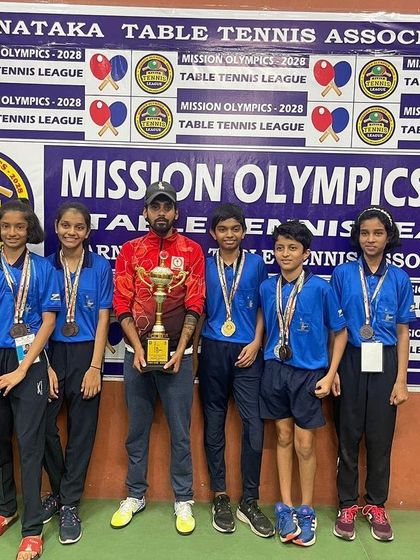 Our team celebrating their wins at the Mini Olympics 2022. We secured medals in team events, singles, and doubles, showing our all-around strength.