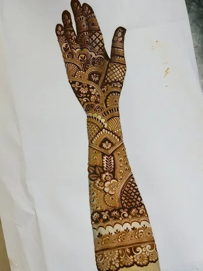 Another incredible design from a student early in the course. The combination of delicate vines, bold fillers, and a clean wrist cuff design is just beautiful.