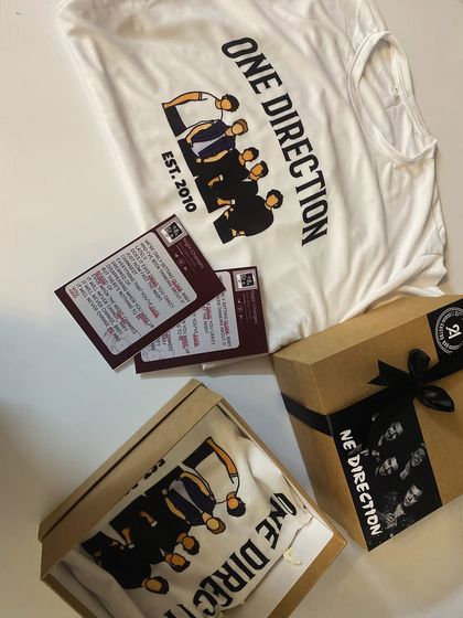 A complete One Direction themed hamper, including a custom t-shirt and a personalized song card. It's a perfect example of how we can create gifts for any niche interest.