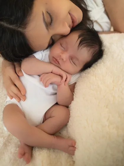 There is nothing more peaceful than a mother cuddling her sleeping newborn. In my lifestyle sessions, I focus on these quiet, intimate moments that feel as soft and warm as they look.