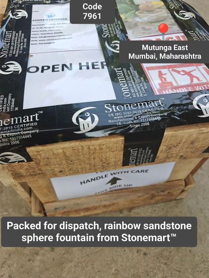 The packed crate for a rainbow sandstone fountain, clearly marked with handling instructions for a safe delivery to Mumbai.
