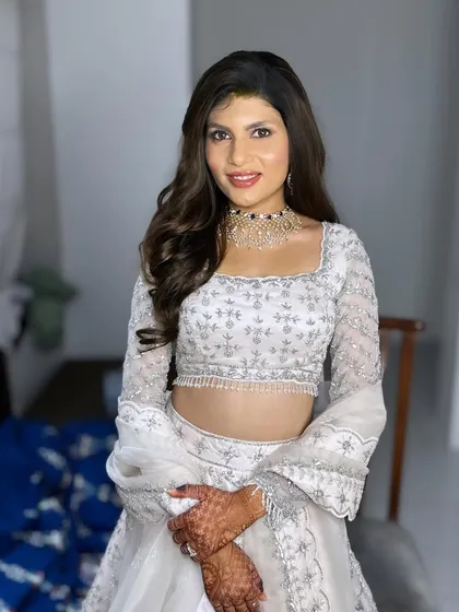 The full reception look. The white-on-white is so chic, and the makeup adds the perfect touch of color and glam.