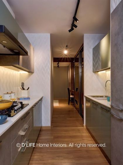 This galley kitchen uses a concrete-finish on the cabinets for a unique, industrial look. Open shelves with colorful pottery add a personal and artistic touch.