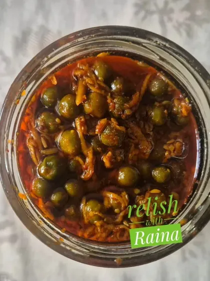 This is a jar of my authentic Rajasthani Kair Pickle. Kair are desert berries that I source directly from Rajasthan during the summer. They are soaked in buttermilk to soften and develop a sour taste before being pickled with grated raw mango and spices. It's a rare flavour that brings the taste of Rajasthan to your plate.