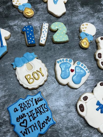 How sweet are these cookies for a baby boy's half-birthday celebration? I can create custom shapes like onesies, bibs, and teddy bears for baby showers and birth announcements.