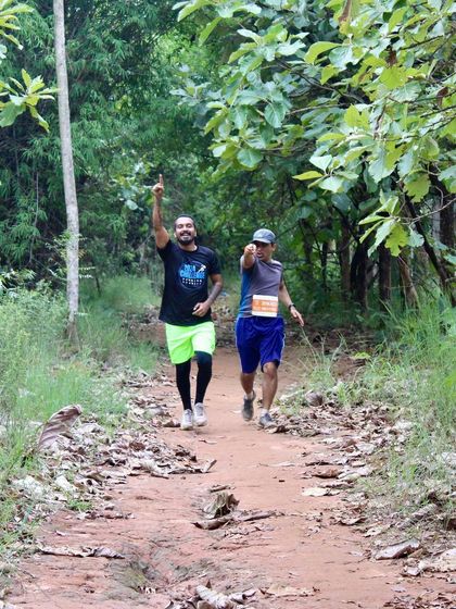 Pointing the way forward on the trail. During long ultra runs, a little encouragement from a friend can make all the difference. We run together, we motivate together.