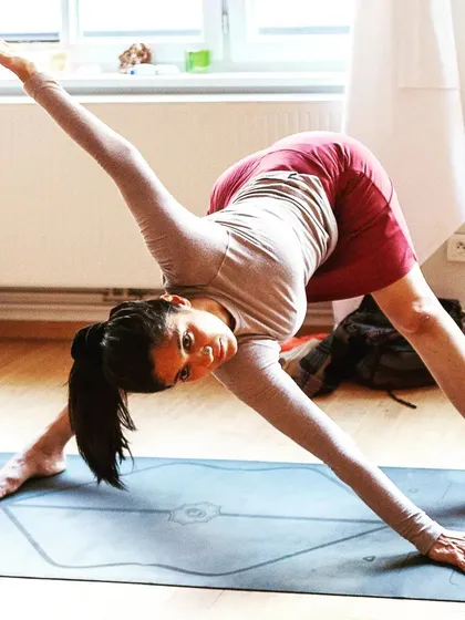 Parivrtta Trikonasana, the revolved triangle pose. This twist reminds us that yoga should extend beyond the mat, bringing a touch of sweetness and light to everything we do.