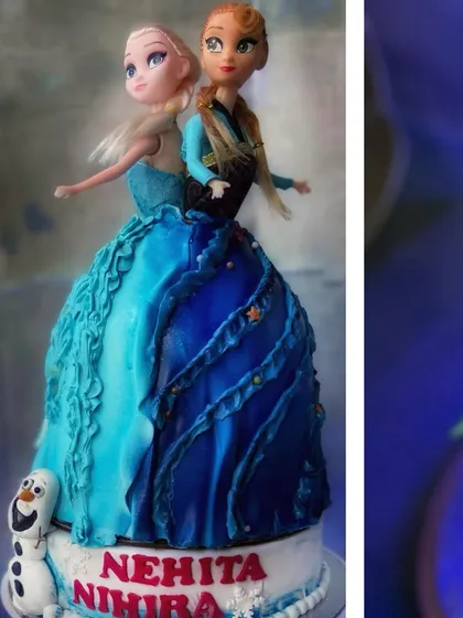 Another angle of the Frozen cake, highlighting the contrasting blue tones of the sisters' dresses.