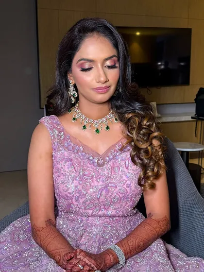 A candid moment of the bride, looking relaxed and beautiful.