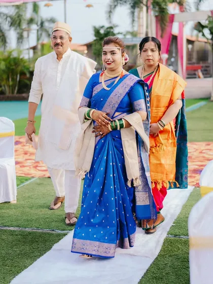 The bride's grand entrance, walking down the aisle with her parents. I focus on capturing the significance and emotion of this moment.