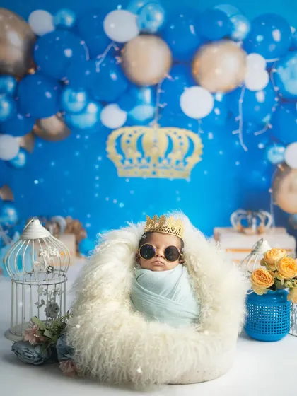 The full royal setup, complete with a balloon arch and regal props. I can create elaborate scenes like this in my studio to match any theme you can imagine.